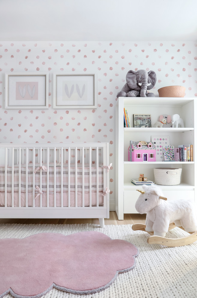 Contemporary nursery in New York with multi-coloured walls for girls.