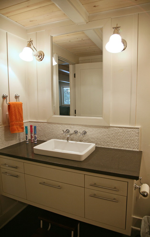 Inspiration for a mid-sized transitional kids' black tile and ceramic tile ceramic tile bathroom remodel in Milwaukee with a vessel sink, flat-panel cabinets, white cabinets, granite countertops and white walls