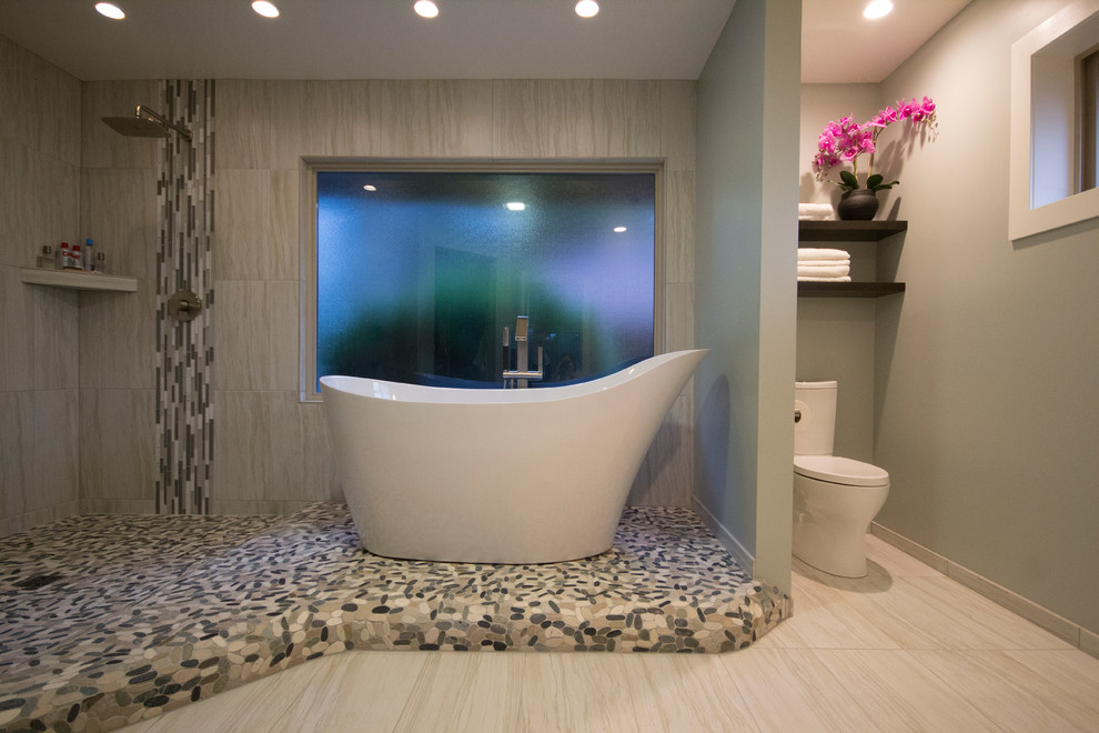 Photo of a mid-sized contemporary master wet room bathroom in Seattle with flat-panel cabinets, dark wood cabinets, a freestanding tub, a two-piece toilet, gray tile, cement tile, green walls, ceramic floors, a vessel sink and engineered quartz benchtops.