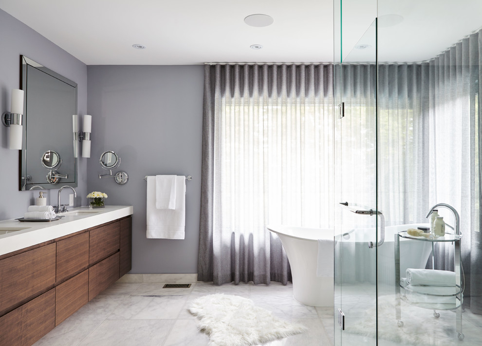 Design ideas for a transitional master bathroom in Toronto with flat-panel cabinets, a freestanding tub, grey walls, porcelain floors, an undermount sink, quartzite benchtops, white floor, a hinged shower door and dark wood cabinets.
