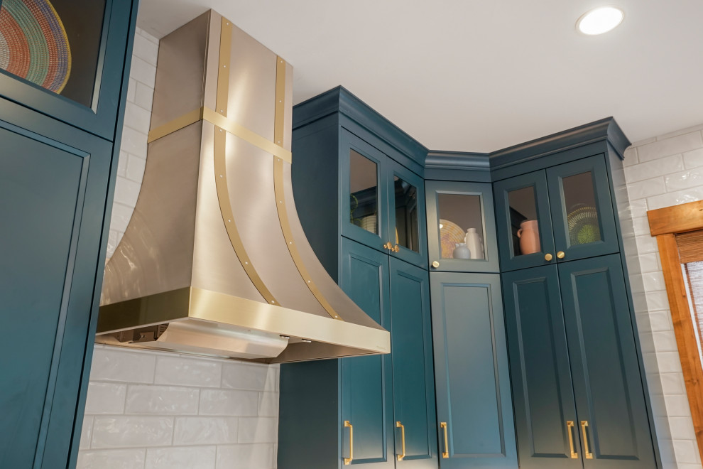 Large transitional u-shaped exposed beam open concept kitchen photo in Denver with an undermount sink, recessed-panel cabinets, blue cabinets, wood countertops, white backsplash, stainless steel appliances and an island