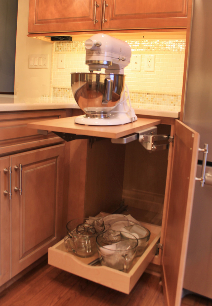Inspiration for a mid-sized medium tone wood floor eat-in kitchen remodel with an undermount sink, medium tone wood cabinets, quartzite countertops, beige backsplash, ceramic backsplash, stainless steel appliances and an island