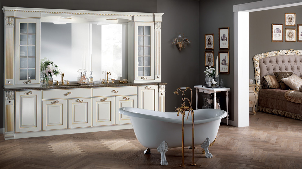 Large traditional master bathroom in Melbourne with an undermount sink, raised-panel cabinets, white cabinets, quartzite benchtops, a claw-foot tub, grey walls and medium hardwood floors.