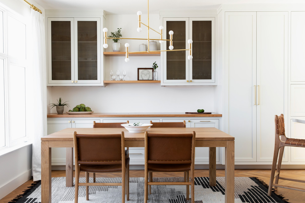 Design ideas for a mid-sized scandinavian dining room in San Francisco with white walls, light hardwood floors and no fireplace.
