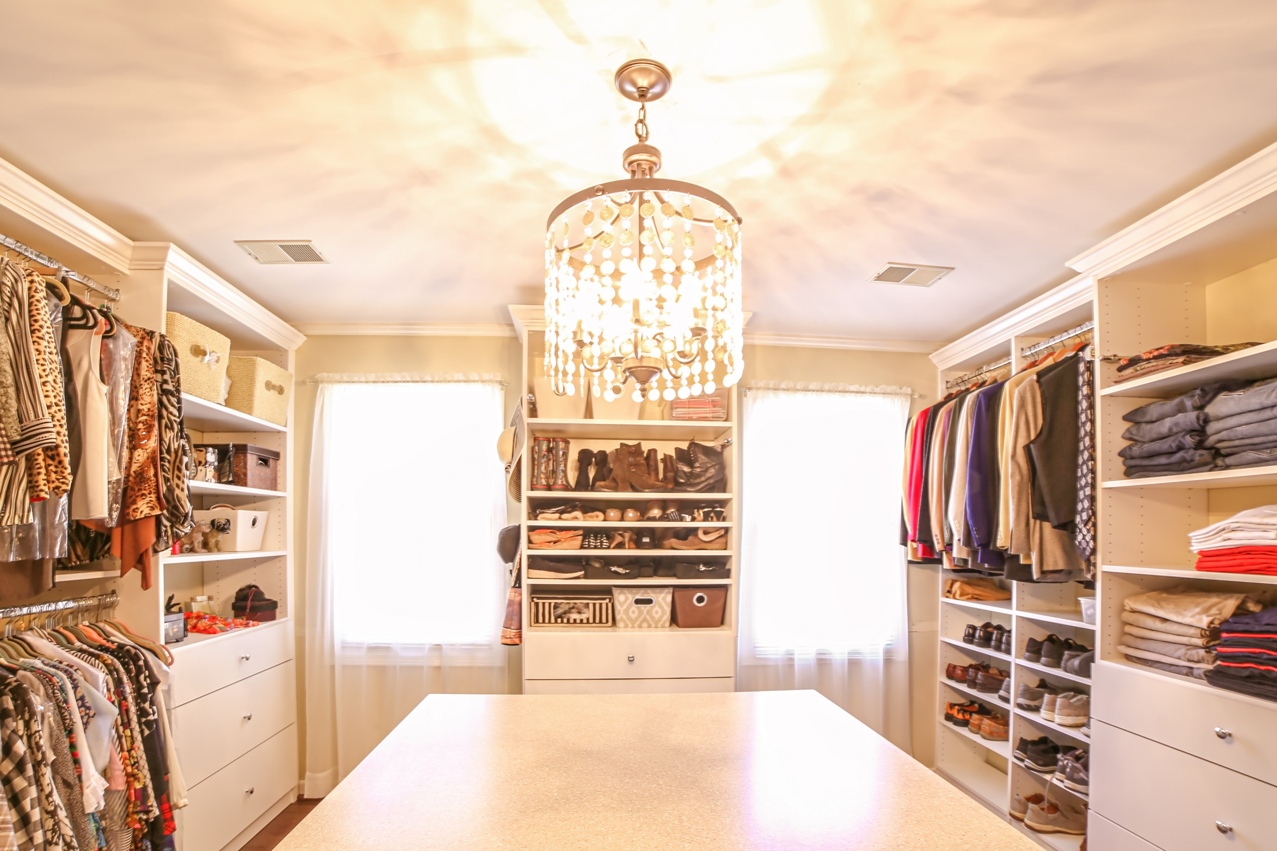 We turned this spare bedroom into a beautiful custom built closet. The homeowner wanted simple yet elegant. The crown detail completes the look.