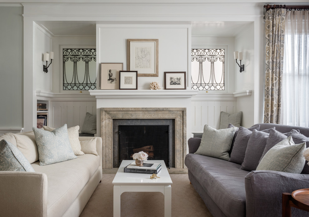 This is an example of a transitional enclosed living room in San Francisco with white walls and a standard fireplace.