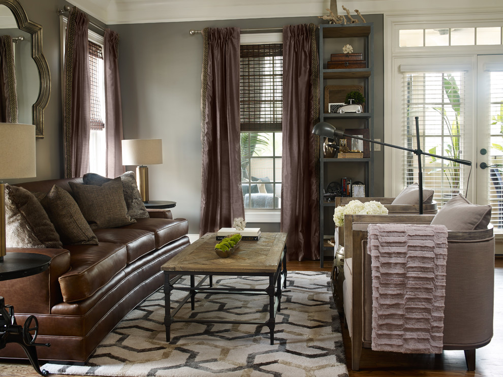 Design ideas for a mid-sized transitional enclosed living room in Atlanta with grey walls and medium hardwood floors.