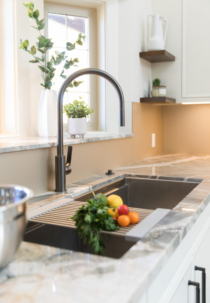 Example of a transitional kitchen design in Calgary