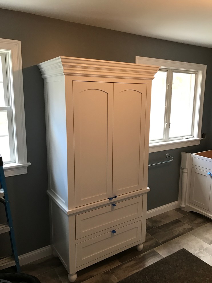 Traditional bathroom in Providence with shaker cabinets and white cabinets.