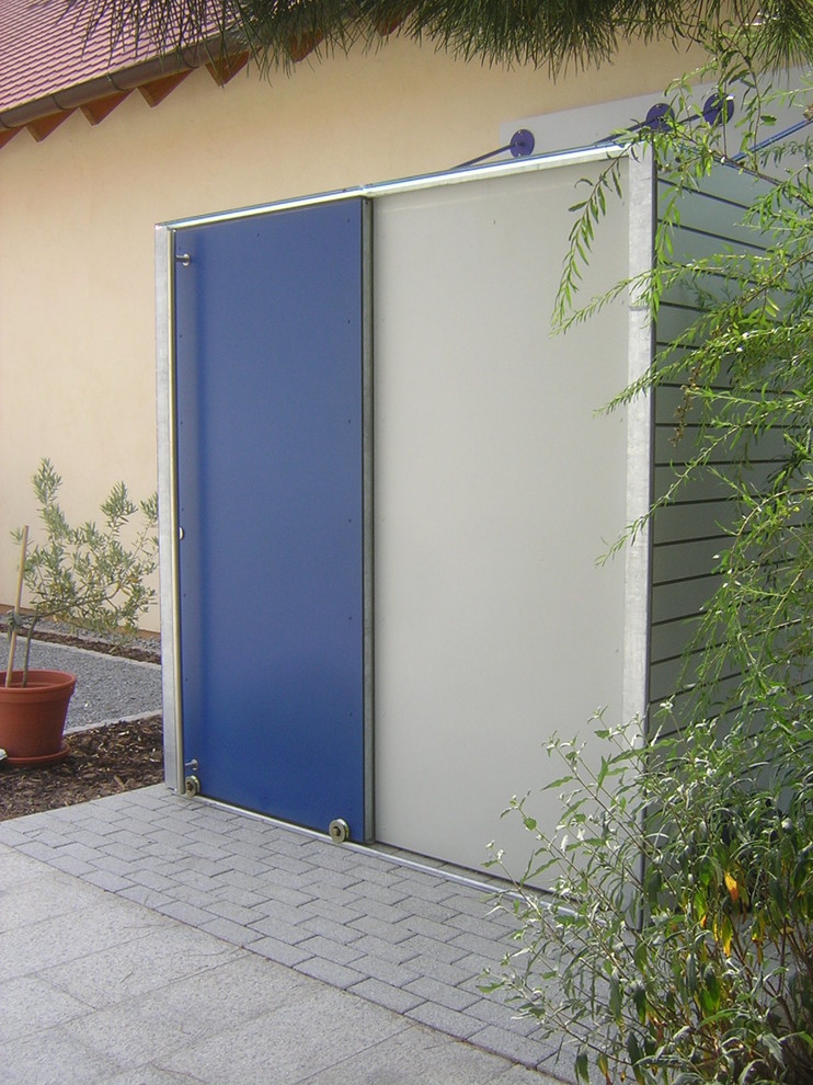 Photo of a mid-sized contemporary shed and granny flat in Stuttgart.