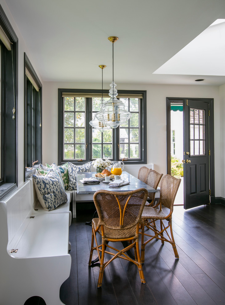 This is an example of a traditional separate dining room in Baltimore with white walls and dark hardwood floors.