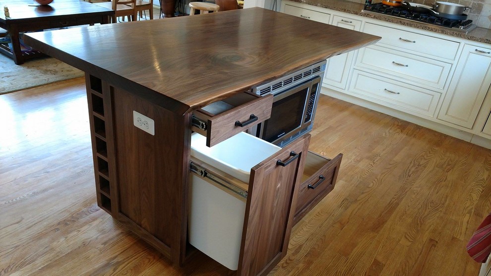 Unfinished and natural finish and mid-sized mountain style wood and l-shaped medium tone wood floor and brown floor open concept kitchen photo in DC Metro with drawers, an undermount sink, beaded inset cabinets, dark wood cabinets, wood countertops, beige backsplash, ceramic backsplash, stainless steel appliances and an island