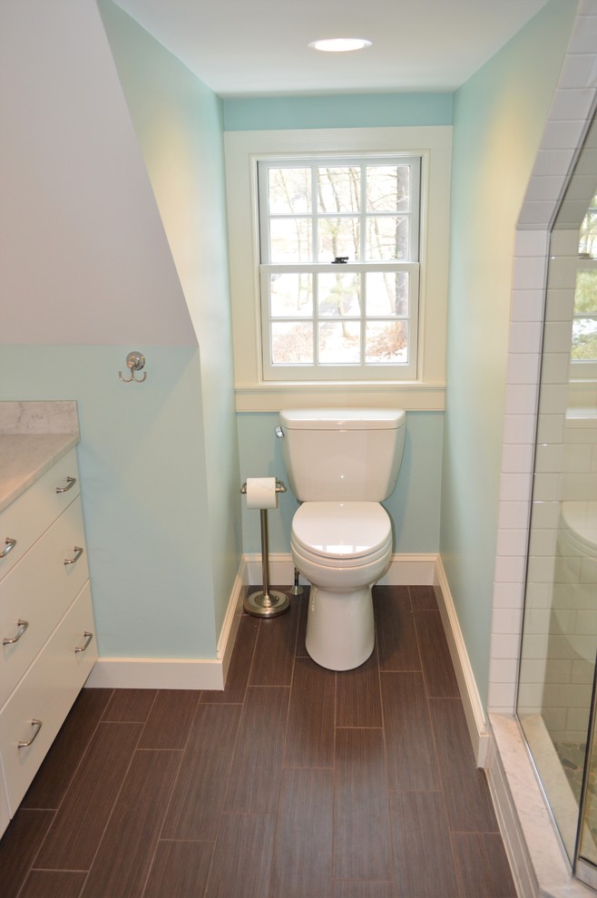 Design ideas for a mid-sized country master bathroom in Boston with flat-panel cabinets, white cabinets, an alcove shower, a two-piece toilet, blue walls, terra-cotta floors, an undermount sink and marble benchtops.