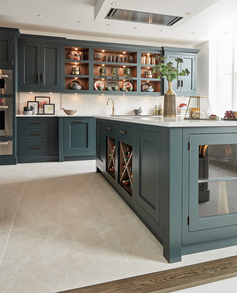 Inspiration for a mid-sized traditional single-wall eat-in kitchen in Gloucestershire with a drop-in sink, shaker cabinets, green cabinets, quartzite benchtops, white splashback, stainless steel appliances, limestone floors, with island, beige floor and white benchtop.