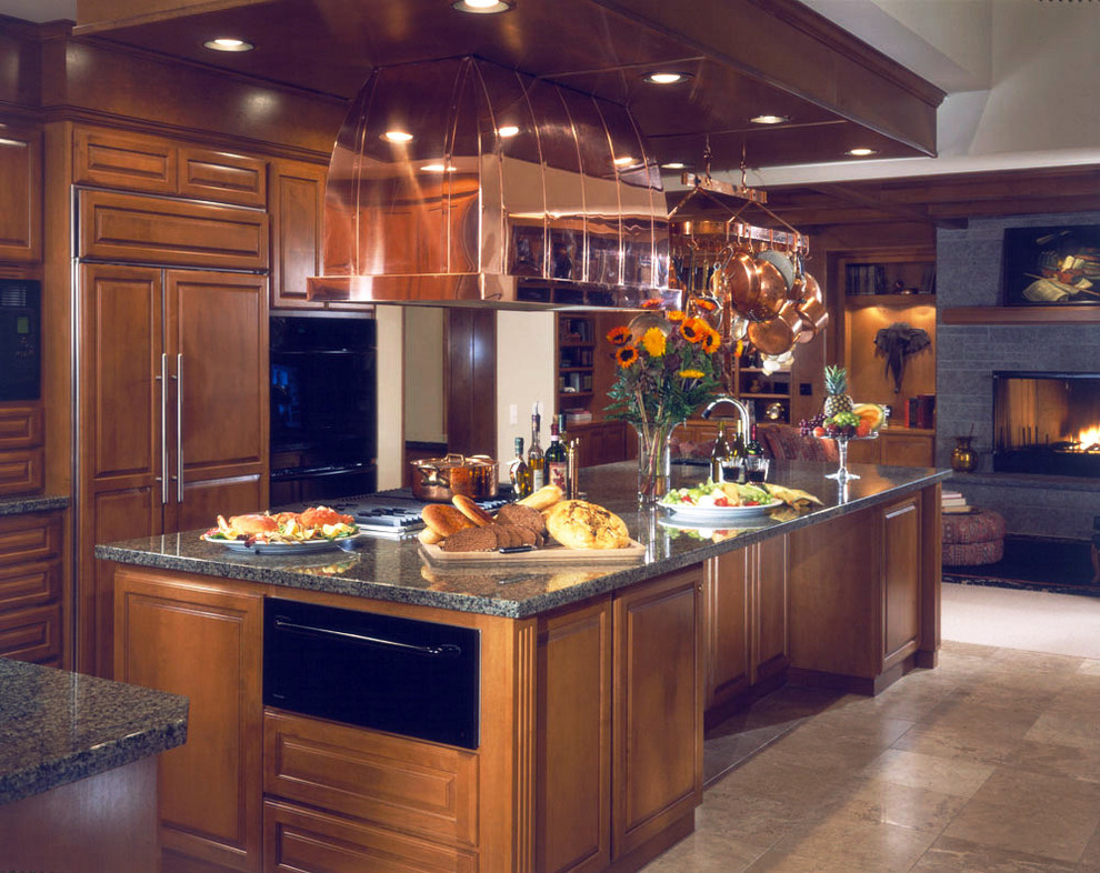 This is an example of a large traditional kitchen in Seattle with a drop-in sink, granite benchtops and ceramic floors.