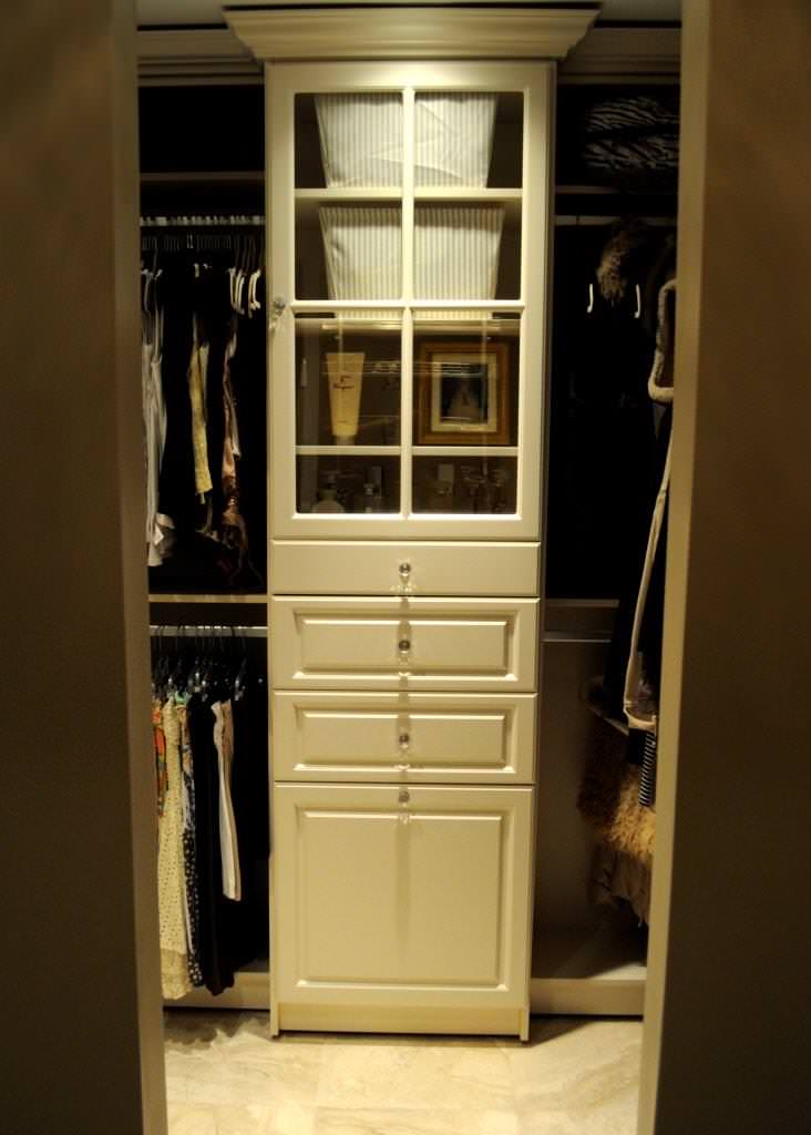 Walk-in Closet with Built-in Hamper and Glass Cabinet