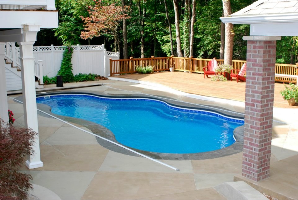 Inspiration for a mid-sized backyard custom-shaped pool remodel in Indianapolis