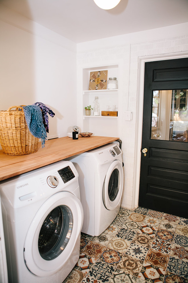 This is an example of a midcentury laundry room in Denver.