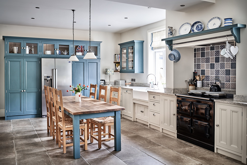 Large traditional eat-in kitchen in Other with a farmhouse sink, beaded inset cabinets, grey cabinets, granite benchtops, blue splashback, mosaic tile splashback, coloured appliances, ceramic floors, no island, brown floor and grey benchtop.