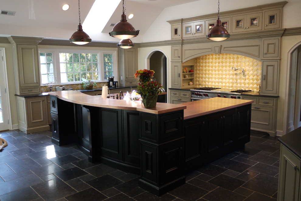 Inspiration for a large traditional l-shaped eat-in kitchen in Newark with copper benchtops, an undermount sink, slate floors, stainless steel appliances, recessed-panel cabinets, beige cabinets, yellow splashback, glass tile splashback and with island.
