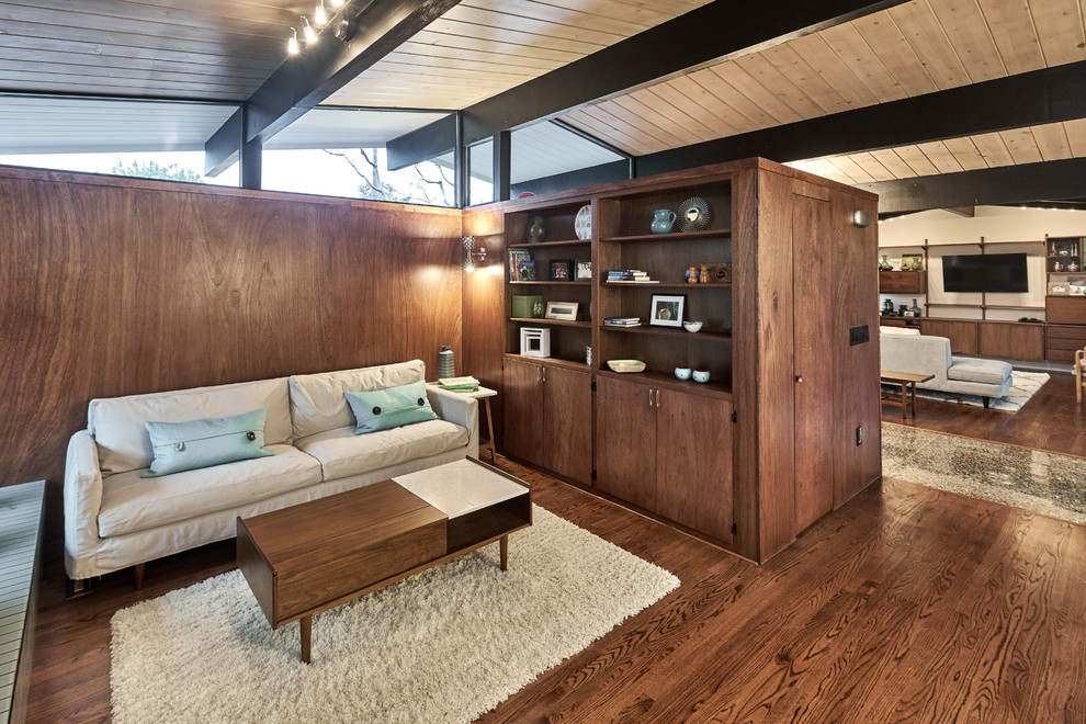 Inspiration for a mid-sized midcentury formal open concept living room in San Francisco with brown walls, brown floor, medium hardwood floors, a standard fireplace, a tile fireplace surround and no tv.