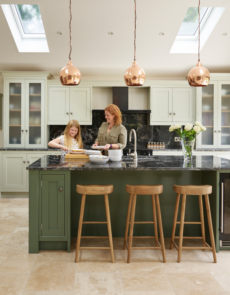 Inspiration for a large contemporary single-wall open plan kitchen in Essex with green cabinets, granite benchtops, black splashback, stainless steel appliances and with island.