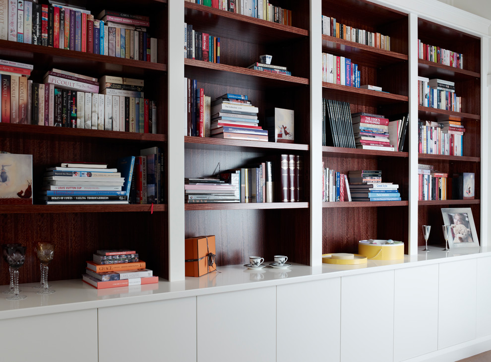 This is an example of a mid-sized contemporary living room in Melbourne with white walls and no fireplace.