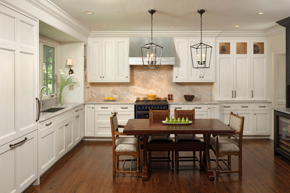 Inspiration for a mid-sized transitional l-shaped open plan kitchen in DC Metro with shaker cabinets, stone slab splashback, panelled appliances, medium hardwood floors, no island, white cabinets, multi-coloured splashback, an undermount sink and zinc benchtops.