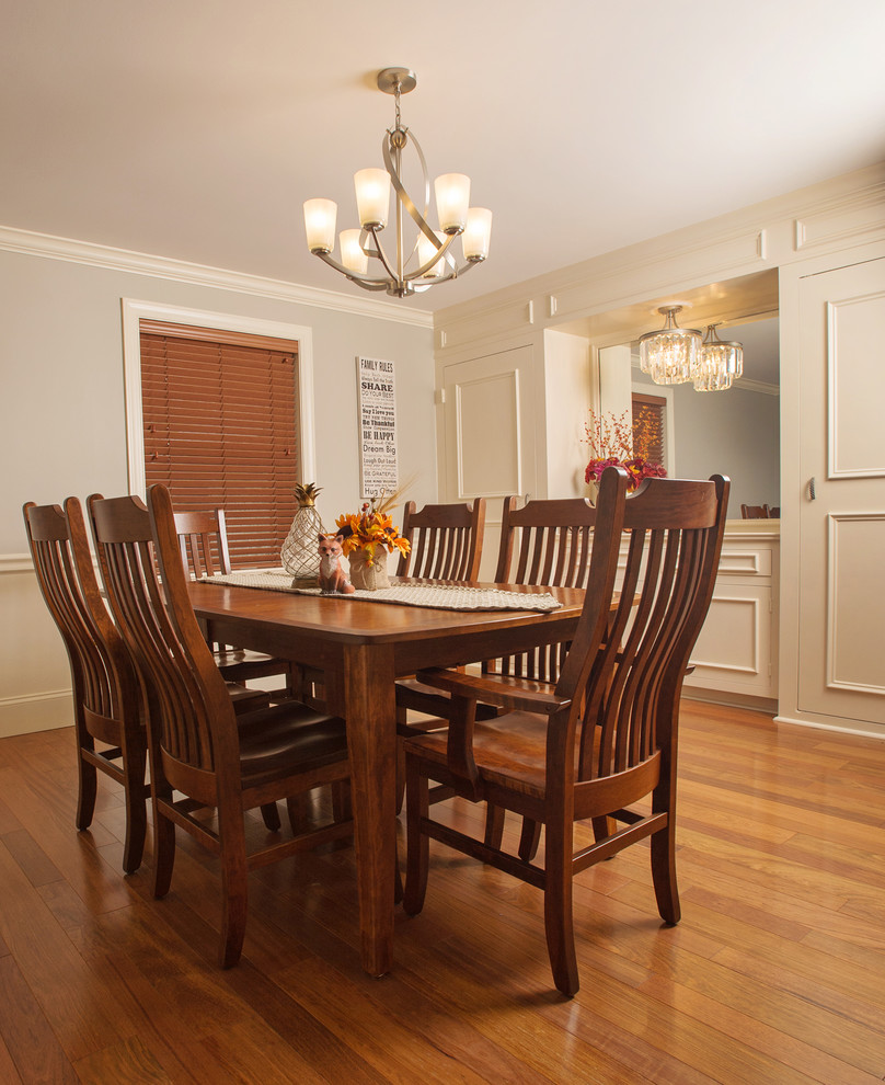 Mid-sized transitional separate dining room in Philadelphia with grey walls, medium hardwood floors and no fireplace.