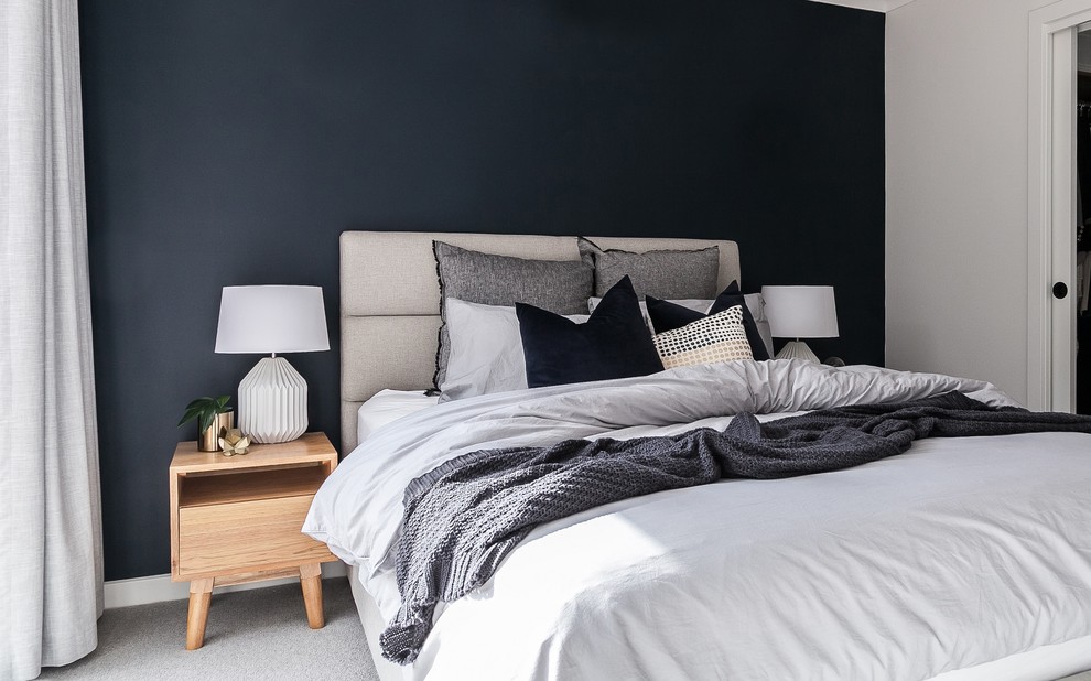 This is an example of a small modern guest bedroom in Melbourne with grey walls, carpet and grey floor.