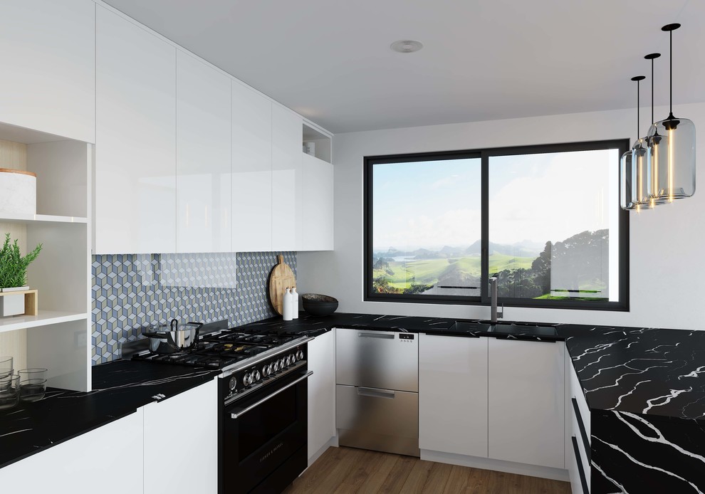 Inspiration for a contemporary u-shaped kitchen pantry in Auckland with a double-bowl sink, flat-panel cabinets, white cabinets, quartz benchtops, multi-coloured splashback, glass sheet splashback, black appliances and black benchtop.