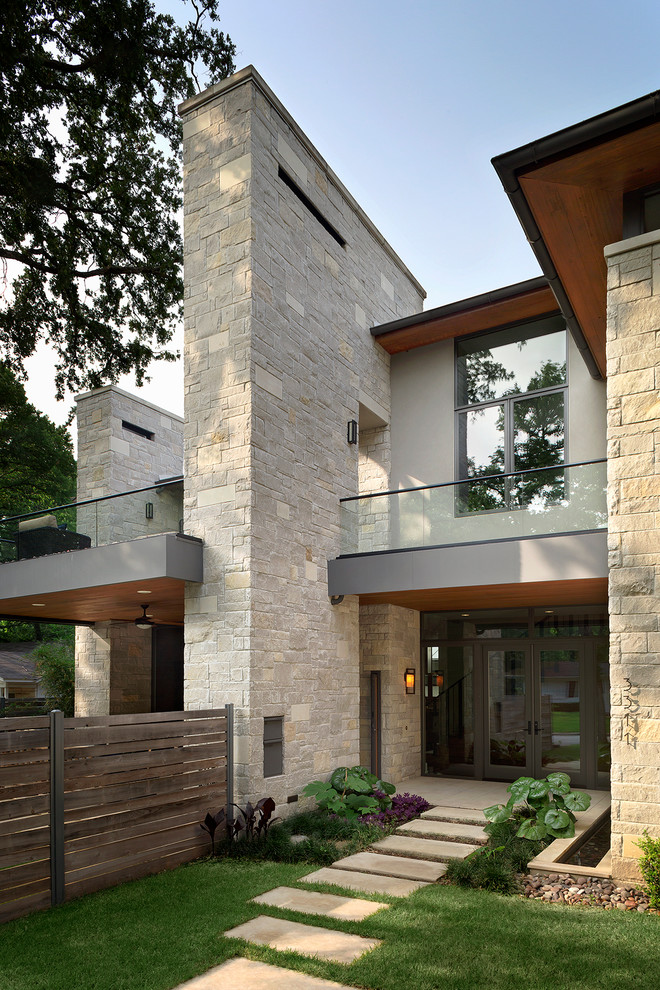 Inspiration for a contemporary beige exterior in Austin with mixed siding.