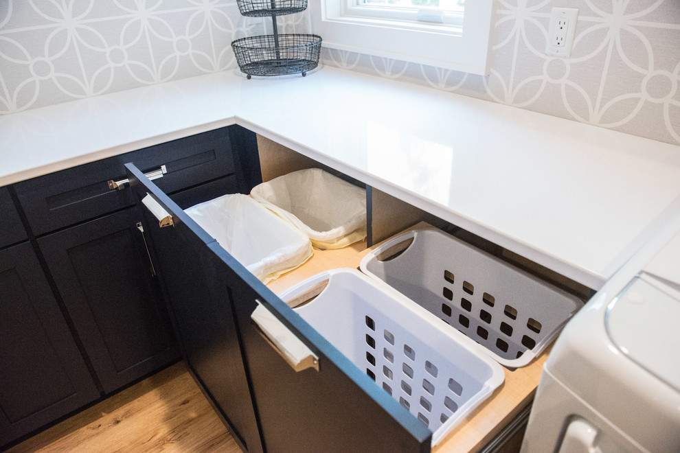 Inspiration for a large transitional u-shaped light wood floor home design remodel with shaker cabinets, blue cabinets, gray walls, a side-by-side washer/dryer and white countertops