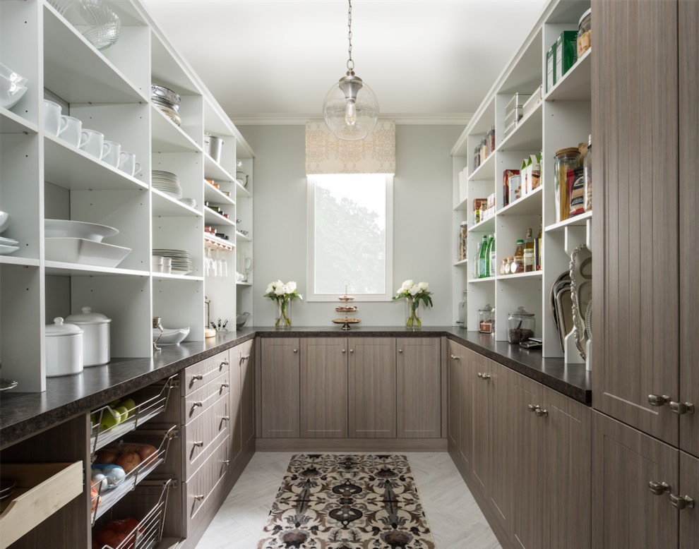 Photo of a transitional u-shaped kitchen pantry in Nashville with shaker cabinets, dark wood cabinets and no island.