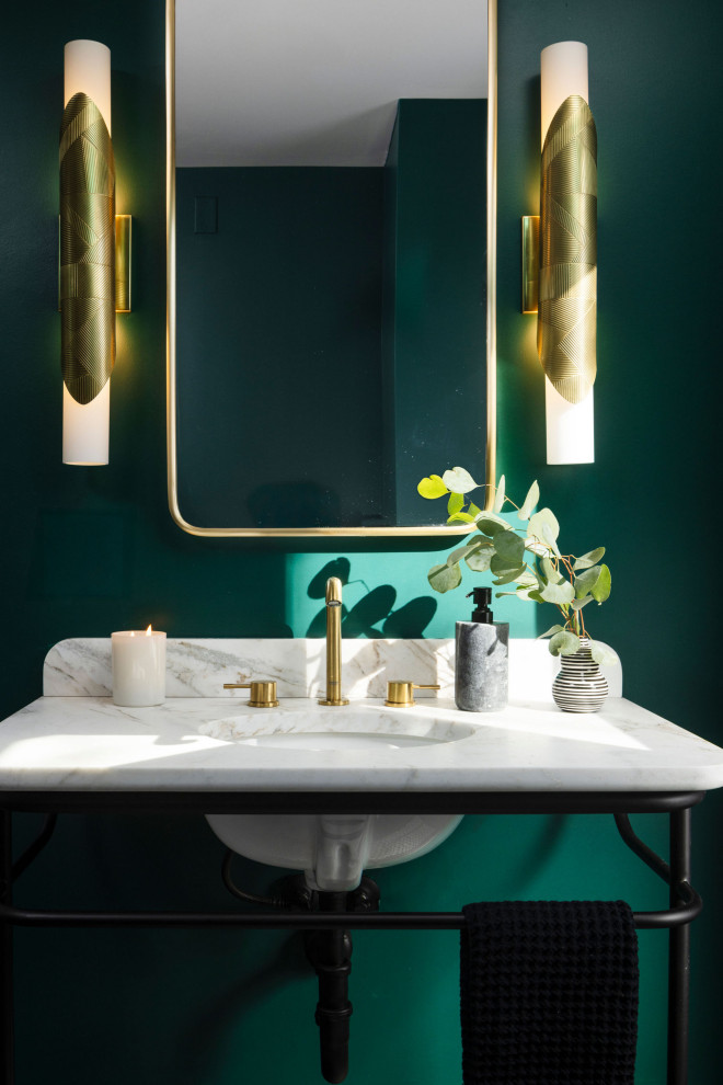 Inspiration for a mid-sized eclectic white tile and ceramic tile ceramic tile and multicolored floor powder room remodel in Denver with black cabinets, a one-piece toilet, green walls, a pedestal sink, marble countertops, white countertops and a freestanding vanity