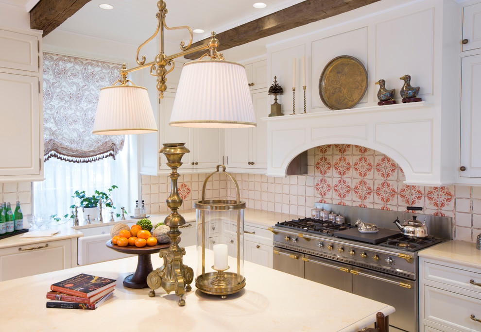 Inspiration for a mid-sized traditional u-shaped eat-in kitchen in New York with a farmhouse sink, beaded inset cabinets, white cabinets, marble benchtops, beige splashback, terra-cotta splashback, white appliances, limestone floors, with island, beige floor and white benchtop.