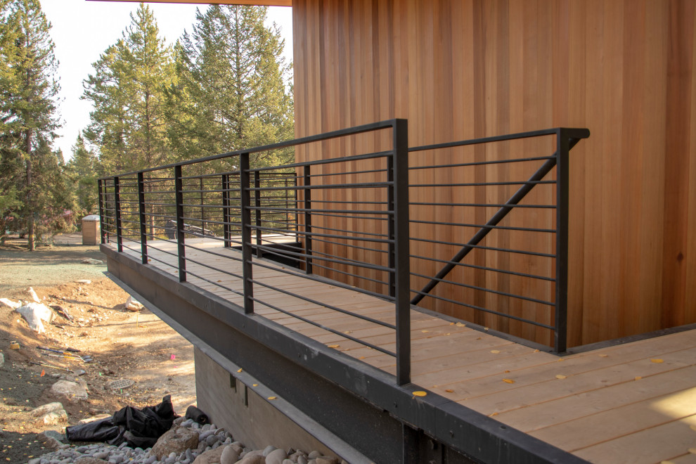Design ideas for a large contemporary metal railing terrace in Other.