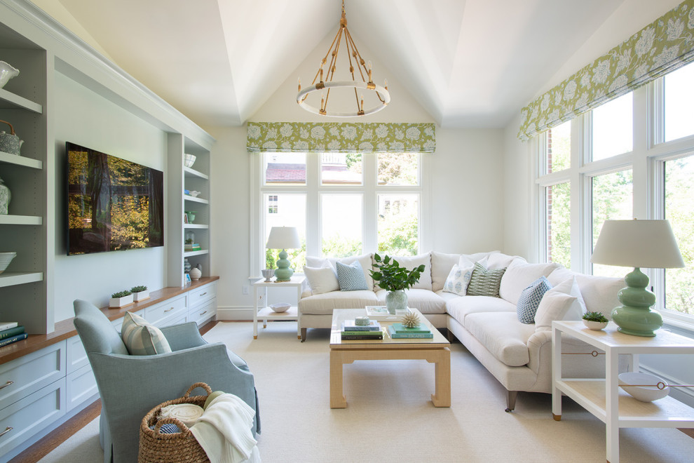 Inspiration for a traditional open concept family room in Boston with white walls, carpet, no fireplace, beige floor, vaulted and a built-in media wall.