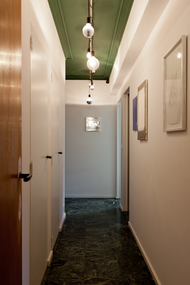 Small transitional light wood floor hallway photo with white walls