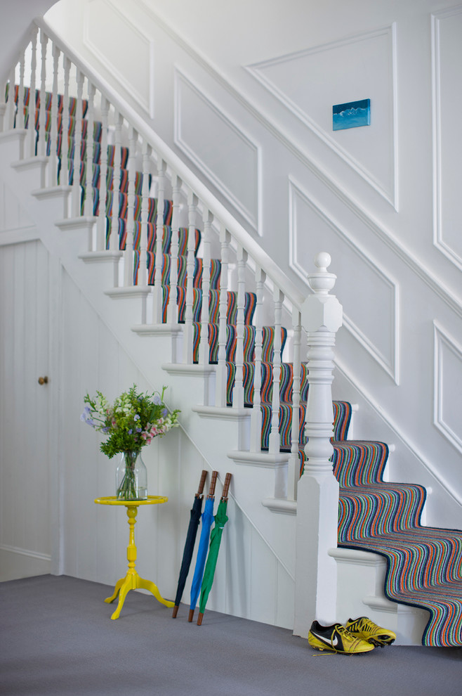 This is an example of a contemporary hallway in Hampshire with carpet.