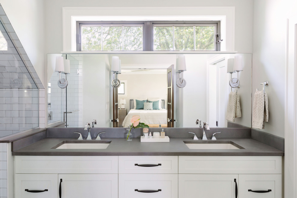 This is an example of a medium sized traditional ensuite bathroom in Chicago with shaker cabinets, white cabinets, an alcove shower, grey tiles, metro tiles, grey walls, medium hardwood flooring, a submerged sink, engineered stone worktops, grey floors, an open shower, grey worktops, double sinks and a built in vanity unit.