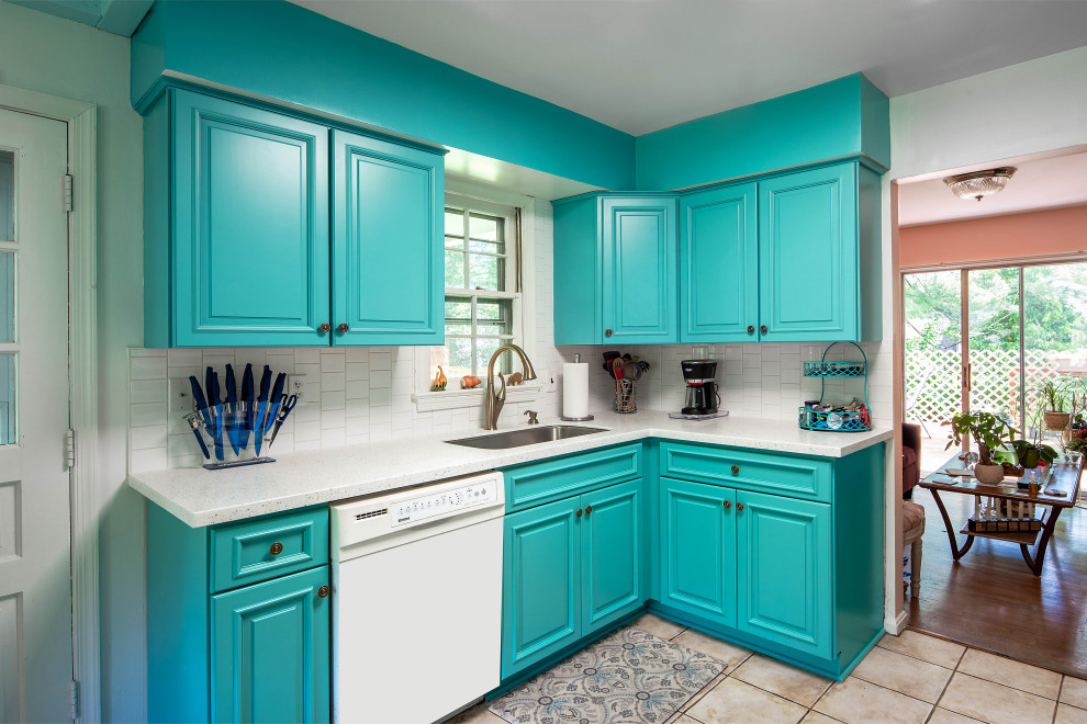 Medium sized eclectic l-shaped kitchen in DC Metro with a submerged sink, blue cabinets, white splashback, porcelain splashback, white appliances, ceramic flooring and multi-coloured floors.