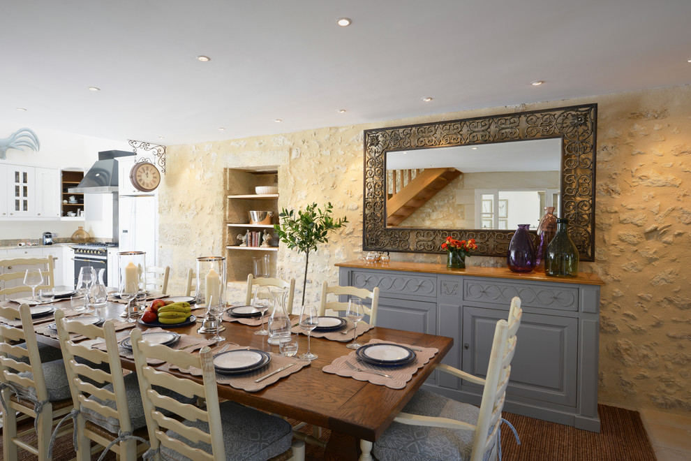 Inspiration for a country kitchen/dining combo in London with beige walls.