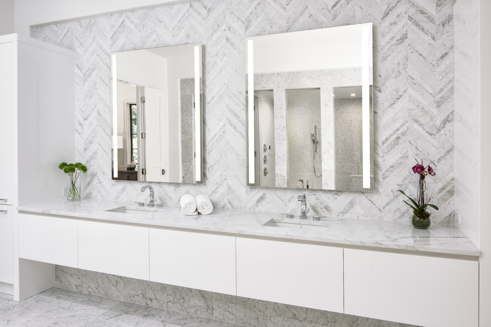 Inspiration for a transitional master bathroom in Charlotte with flat-panel cabinets, white cabinets, a freestanding tub, a double shower, a wall-mount toilet, white tile, marble, white walls, marble floors, a vessel sink, marble benchtops, white floor and a hinged shower door.