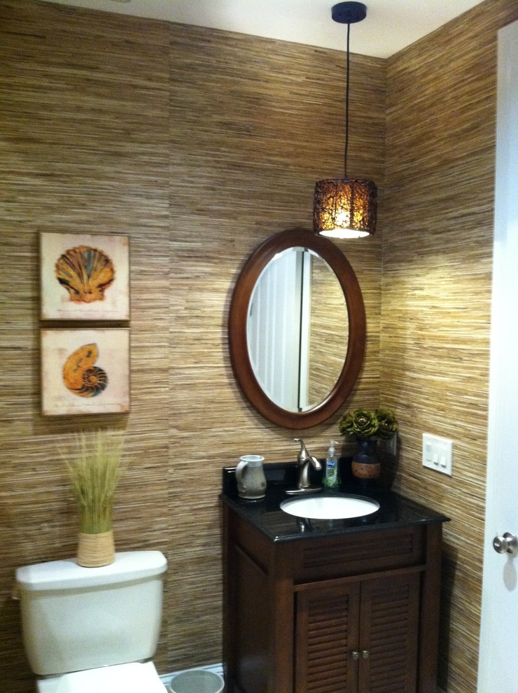 Photo of a tropical powder room in Other.