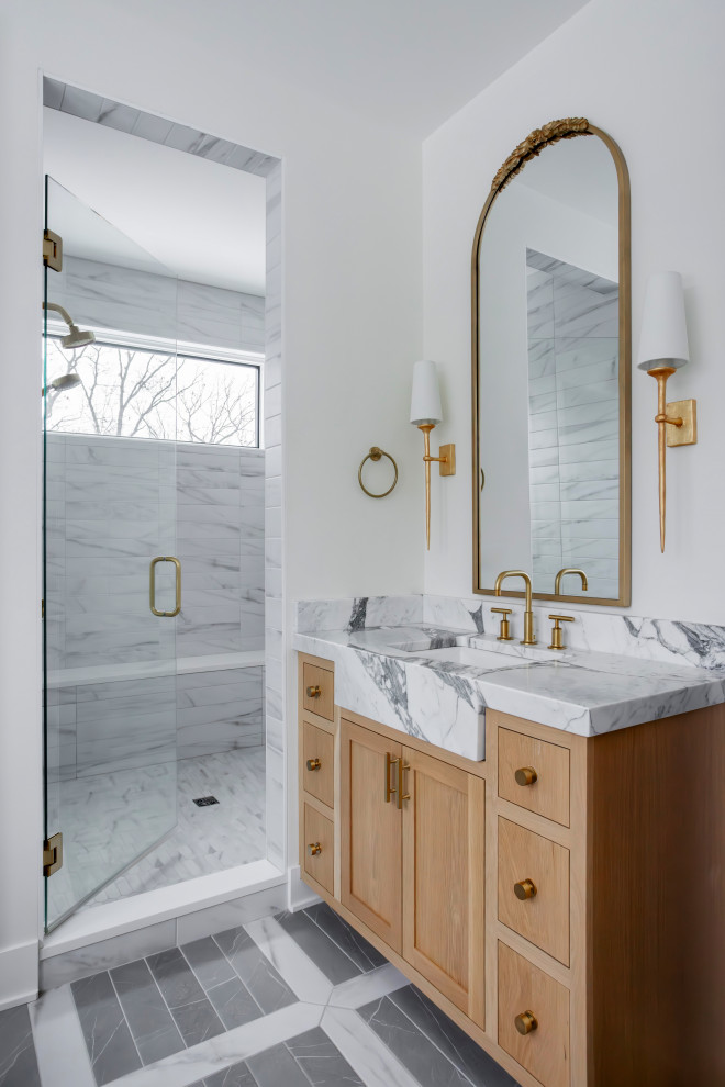 Inspiration for a classic bathroom in Grand Rapids with shaker cabinets, medium wood cabinets, an alcove shower, white tiles, white walls, a submerged sink, grey floors, a hinged door, white worktops, a single sink and a built in vanity unit.