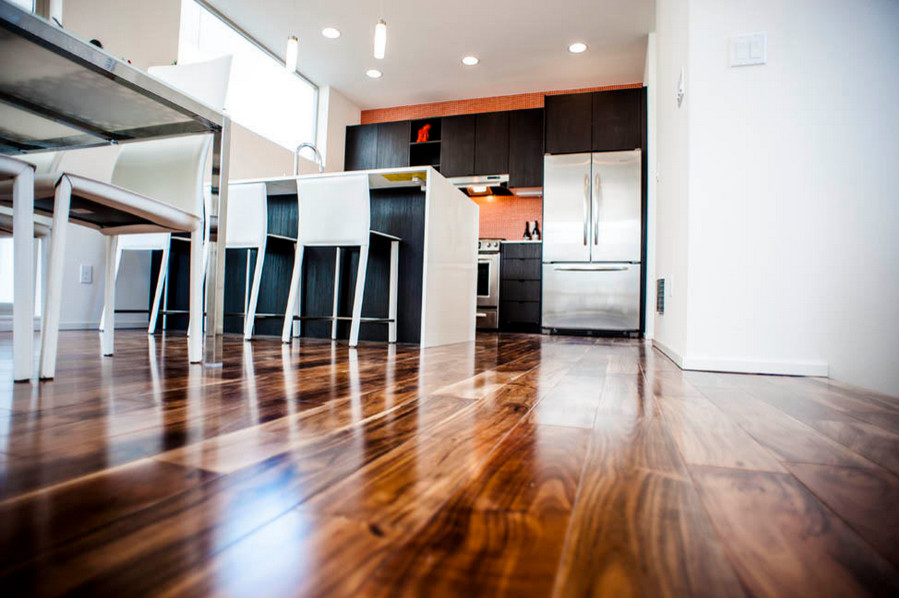 Example of a small trendy galley brown floor and bamboo floor eat-in kitchen design in Portland with flat-panel cabinets, dark wood cabinets, solid surface countertops, an island, orange backsplash, mosaic tile backsplash and stainless steel appliances