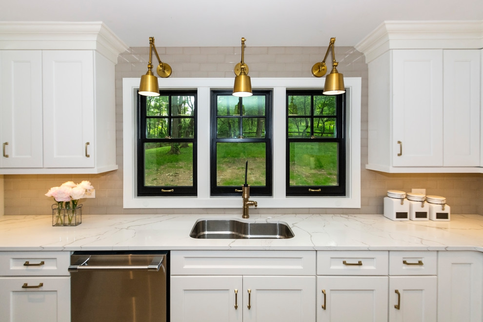 Transitional brown floor kitchen photo with an island