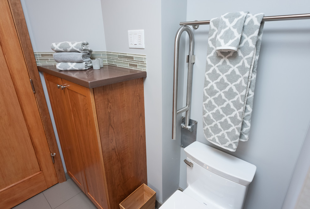 Inspiration for a transitional bathroom remodel with a one-piece toilet