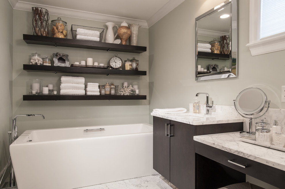 Mid-sized transitional master bathroom in St Louis with an undermount sink, flat-panel cabinets, beige cabinets, marble benchtops, a freestanding tub, an alcove shower, white tile, stone tile, grey walls and marble floors.
